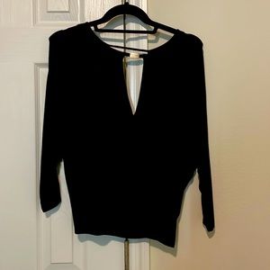 Never worn black top in size XS with open back amazing condition